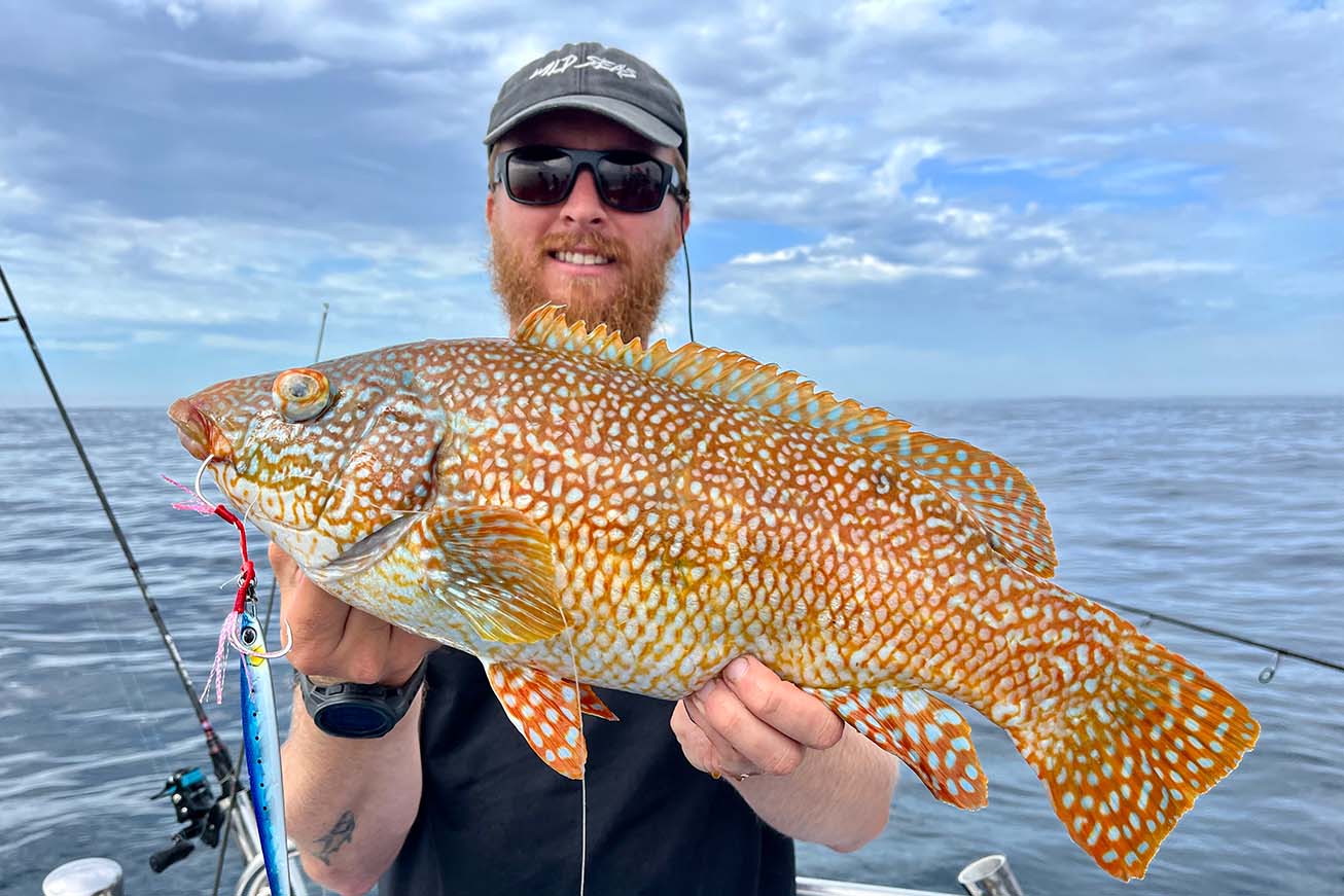 Sam holding a fish proudly