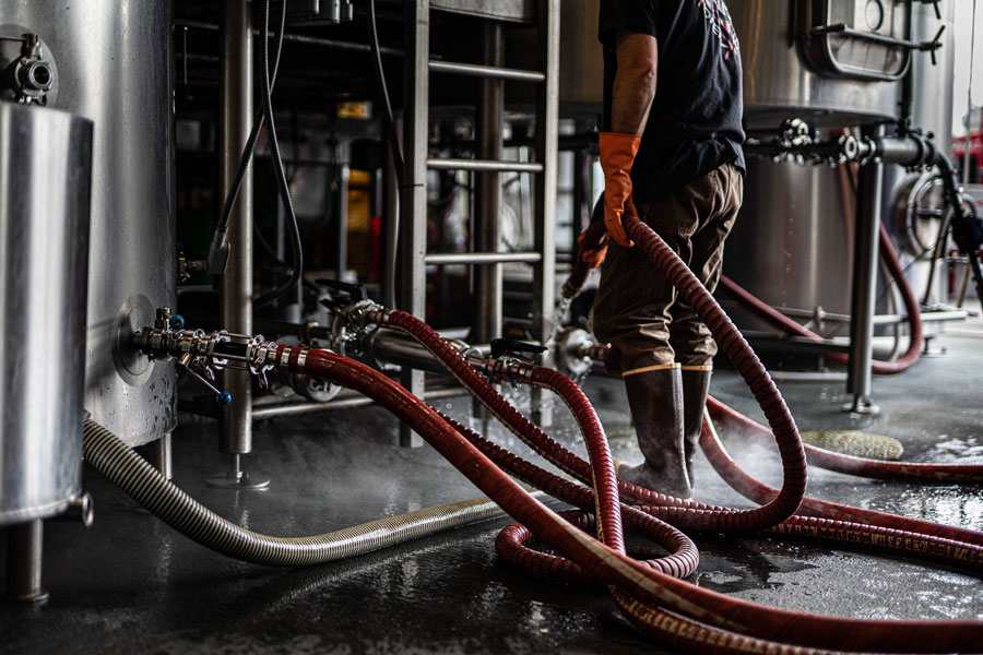 Wide Ride brewer working with red hose
