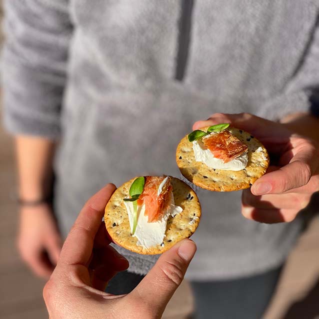 McKenna and friend enjoying the smoked salmon on a cracker with cream cheese.