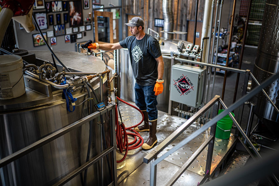 Wild Ride Brewer working on metal brew deck