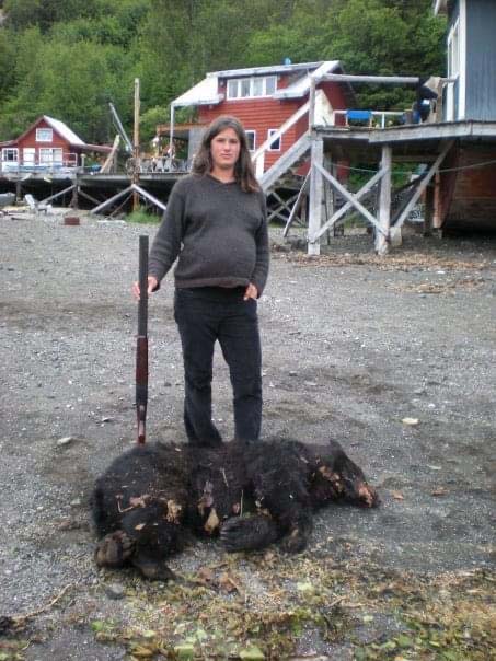 Weatherly Bates, standing over a fallen bear