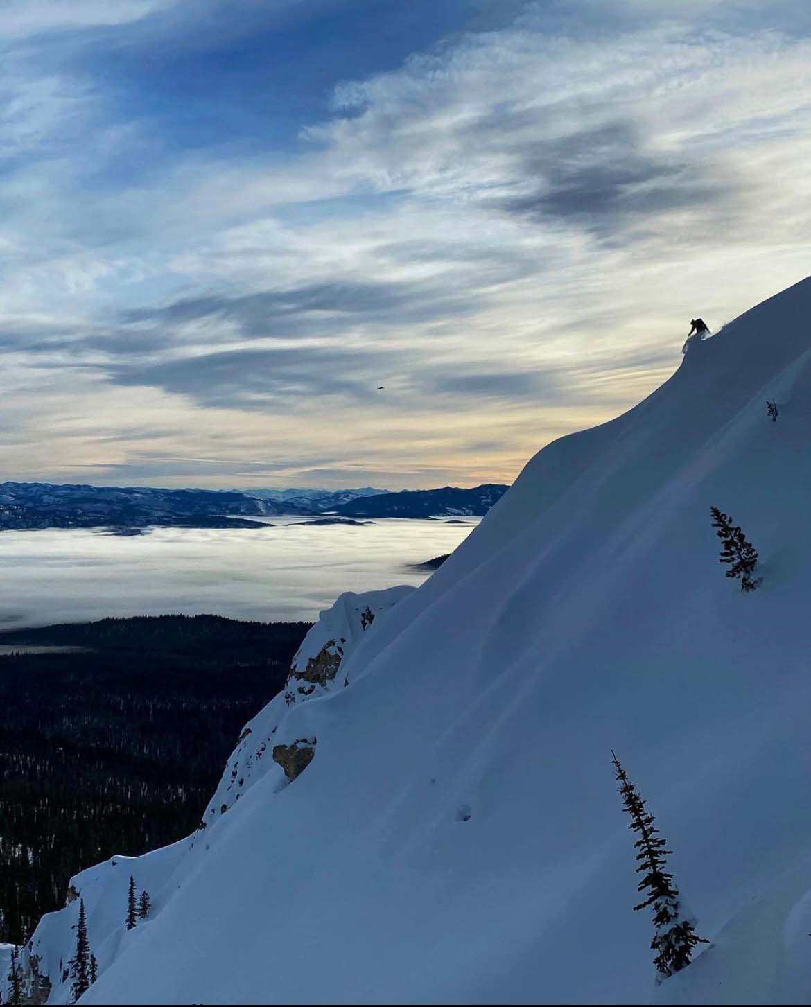 Aerial shot of Mckenna on a snowy peak