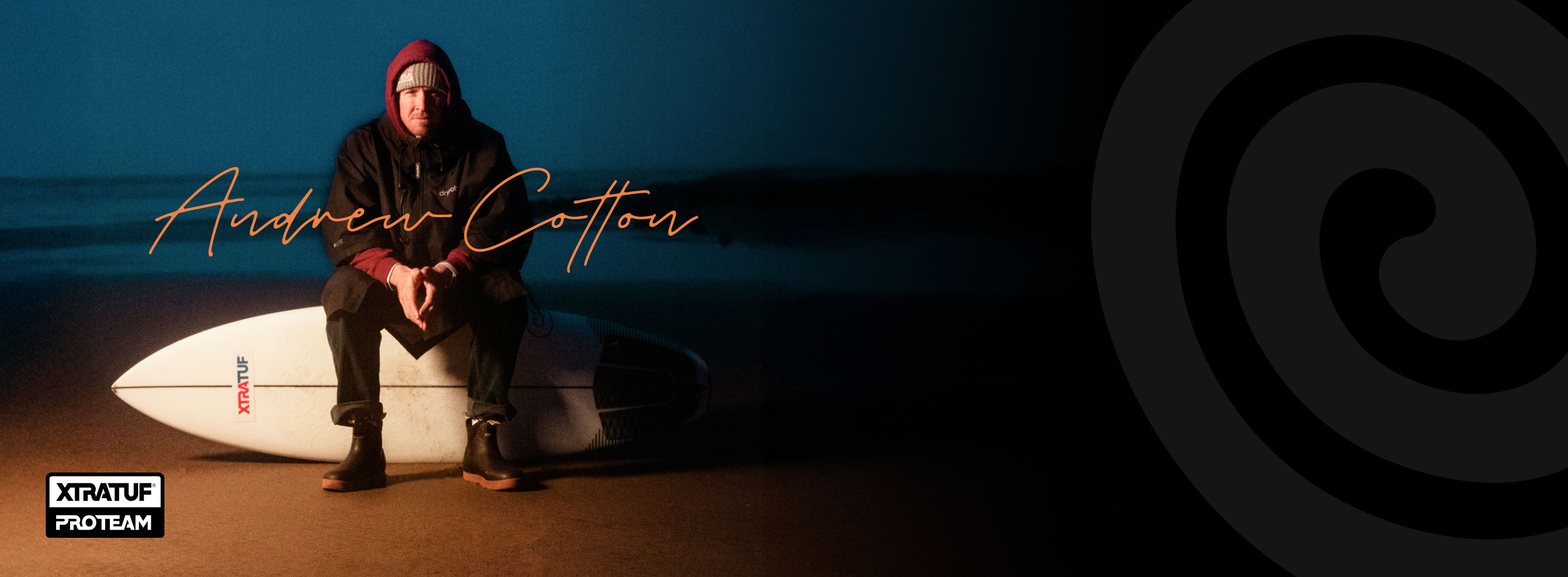 andrew cotton sitting on surf board