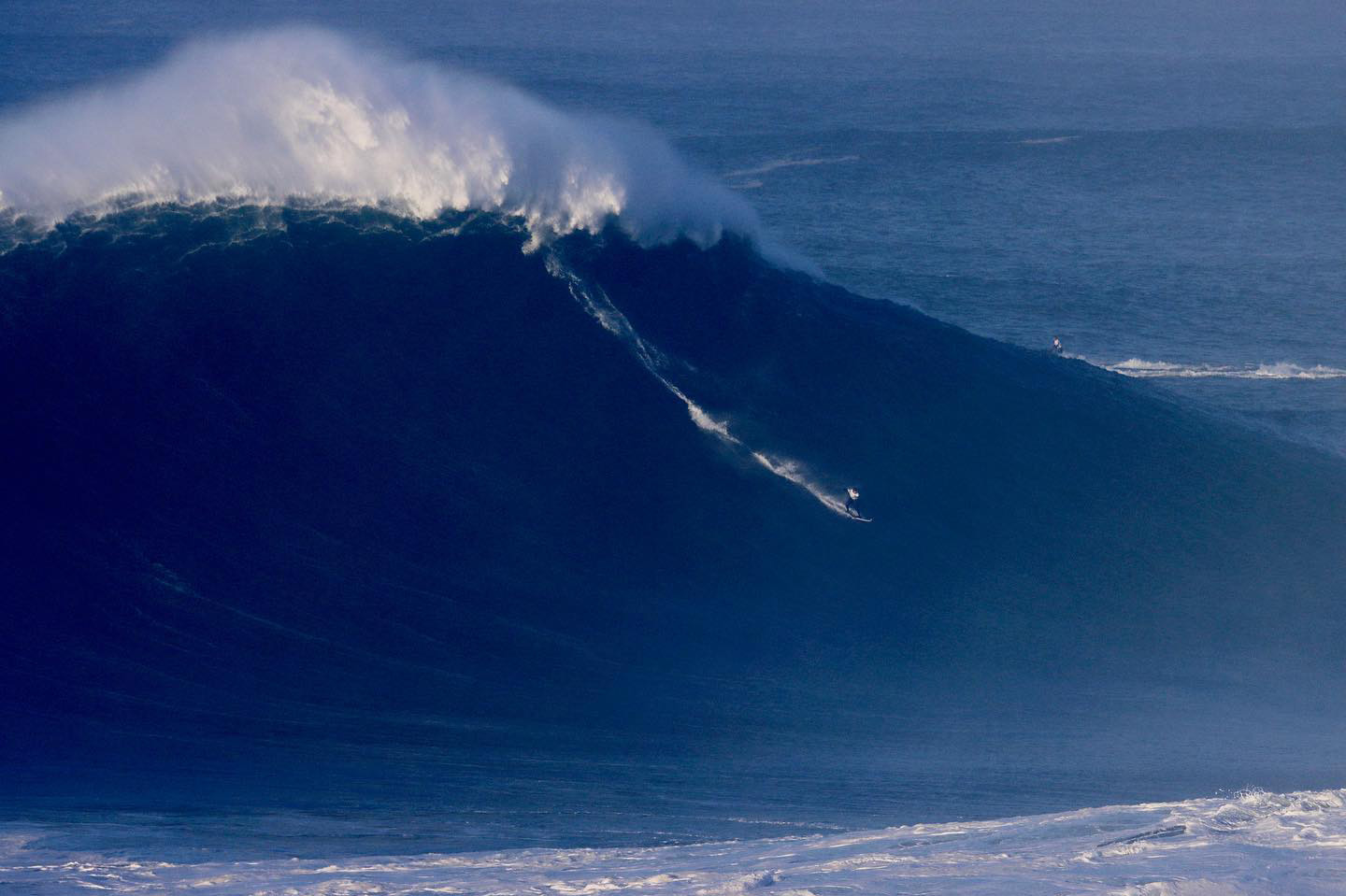 Andrew surfing large wave