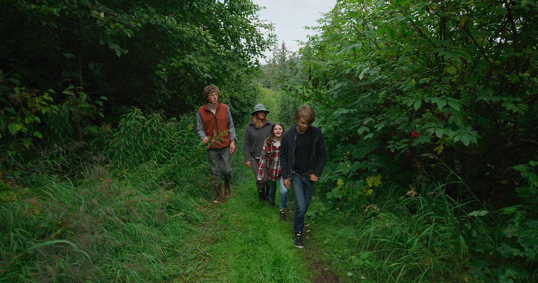 The bates family on a walk through the woods