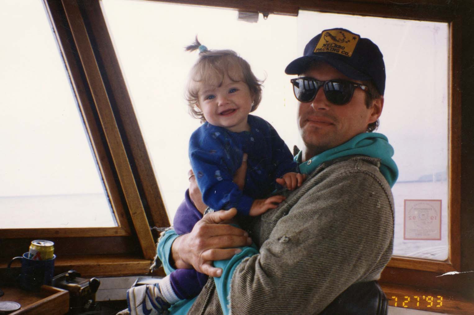 McKenna as a toddler, held by her father. Photo dated 07-27-1993