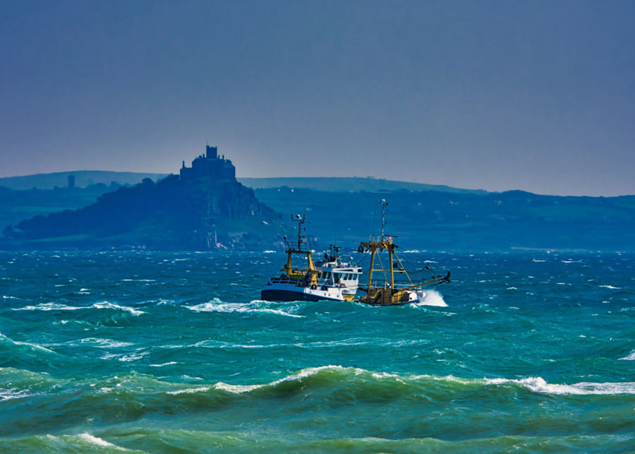 Commercial fishing boat in rough seas. 