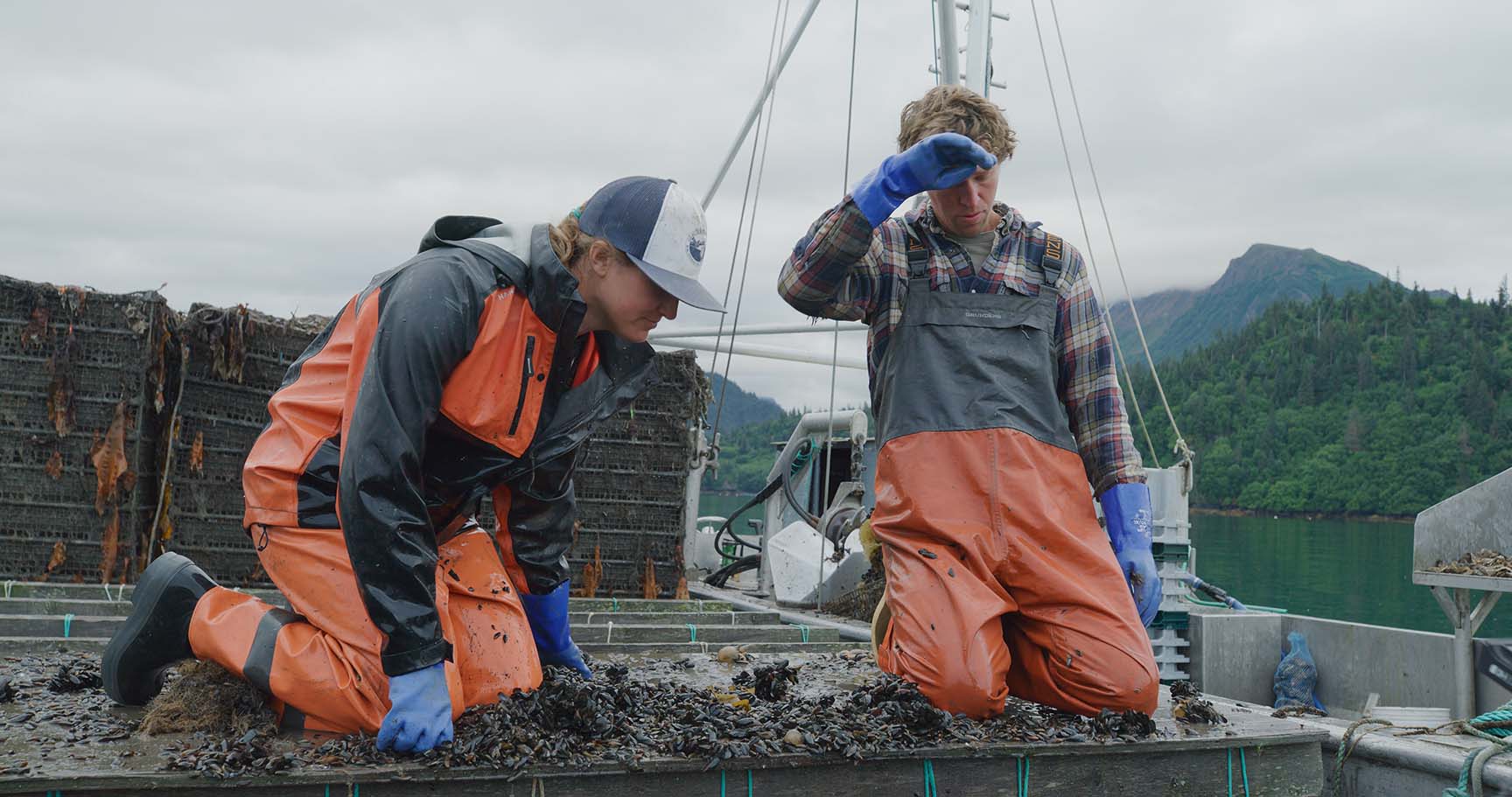 Greg and Weatherly Bates working on a fishing boat