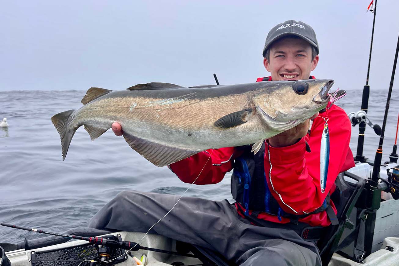 Liam proudly holding a fishing