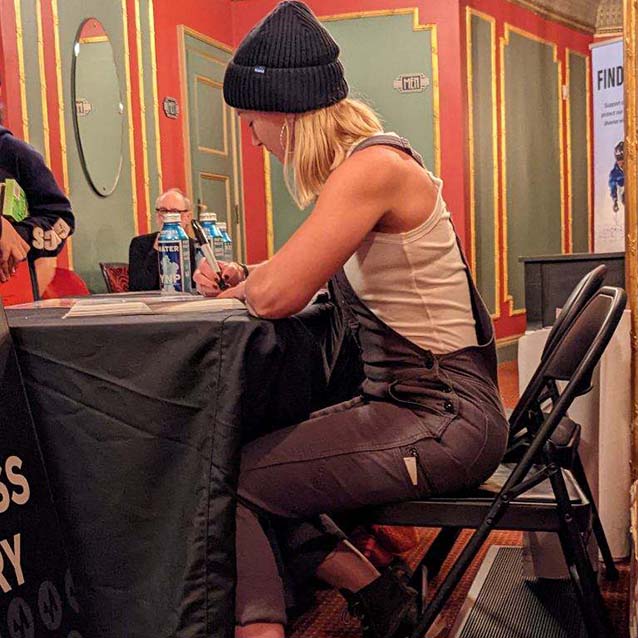 McKenna signing autographs at the Warren Miller ski film premiere event.