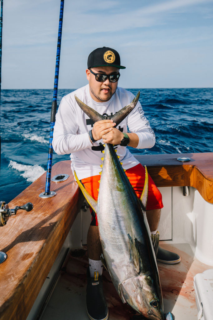 Bao Thai holding a yellowfin tuna.