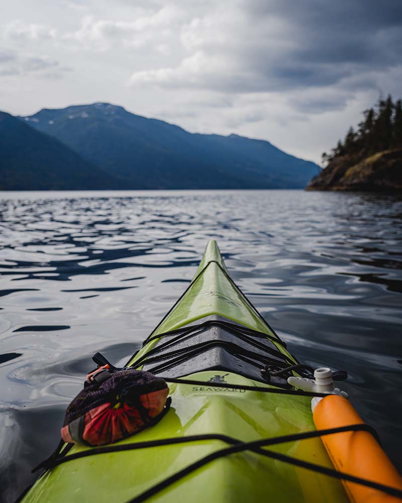 Point of view from Errin's kayak over looking the water with a mount back frop