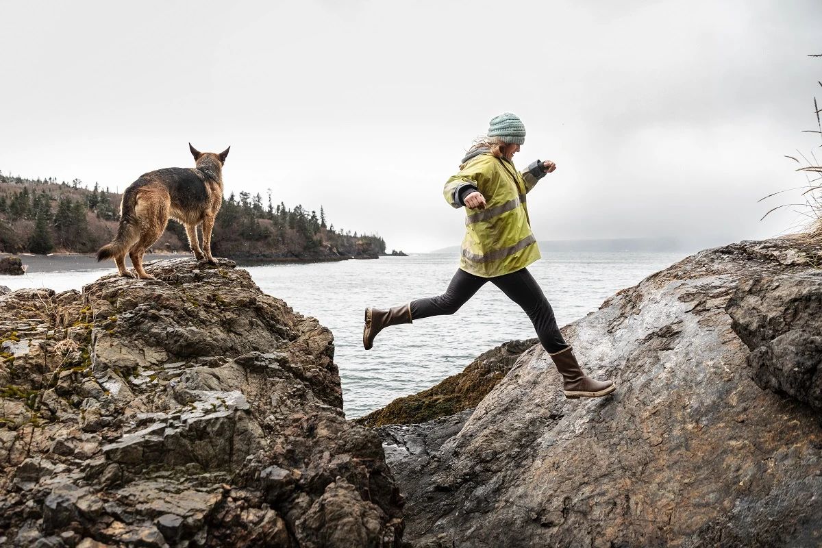 Woman hikes in Legacy Boots with her German Shepard dog